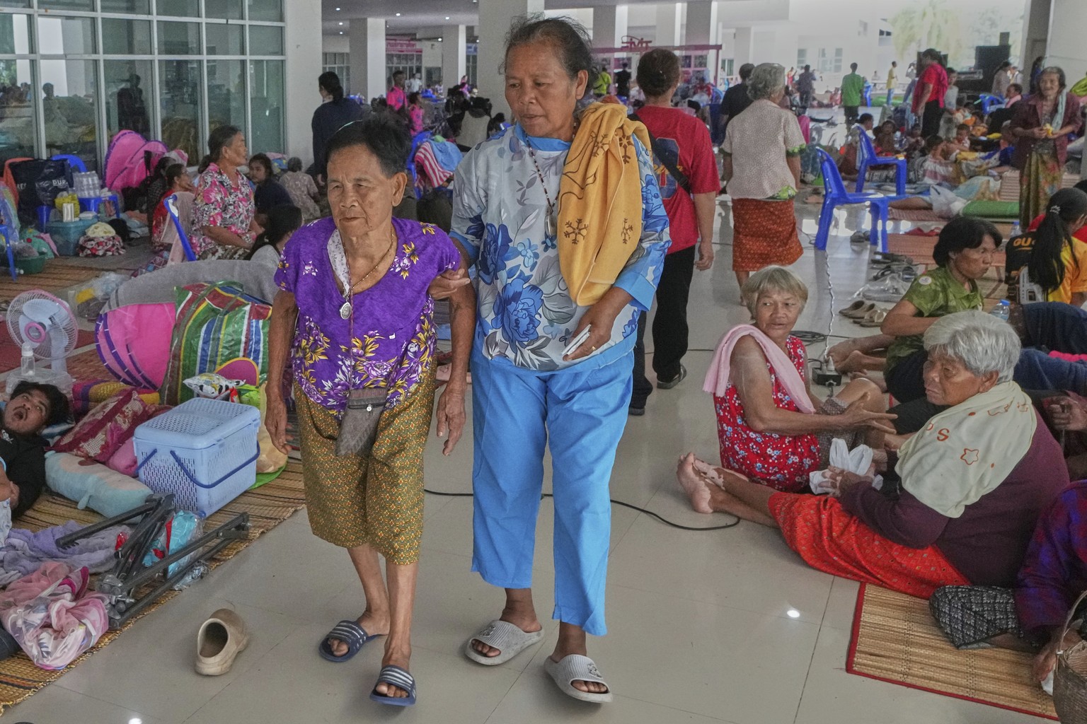 Thai residents who fled homes following clashes between Thai and Cambodian soldiers rest at an evacuation center in Surin province, Thailand, Sunday, July 27, 2025. (AP Photo/Sakchai Lalit)
Thailand C ...