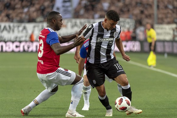 Basel&#039;s Eder Balanta, left, fights for the ball against PAOK&#039;s Dimitris Limnios, right, during the UEFA Champions League second qualifying round first leg match between Greece&#039;s PAOK FC ...