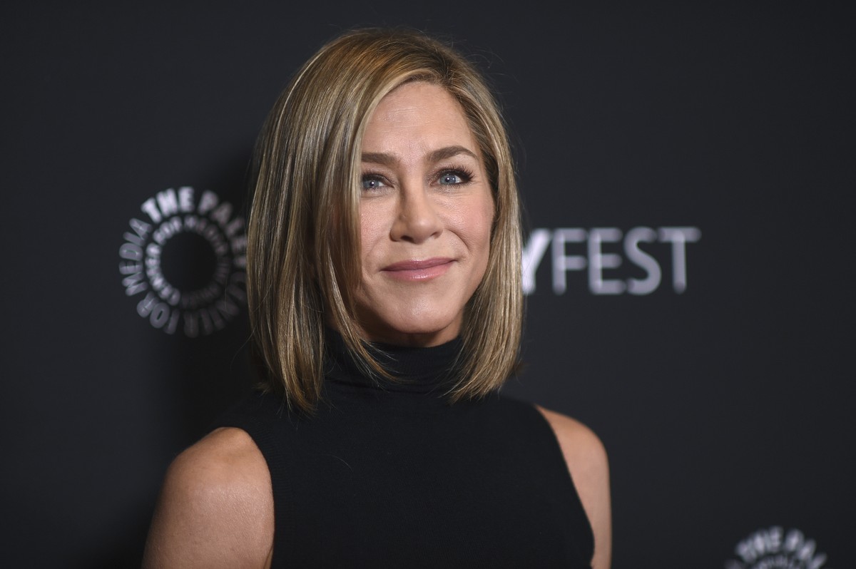 FILE - Jennifer Aniston arrives at a screening of "The Morning Show" during PaleyFest, April 12, 2024, at the Dolby Theatre in Los Angeles. Aniston will soon become a children's author. ...