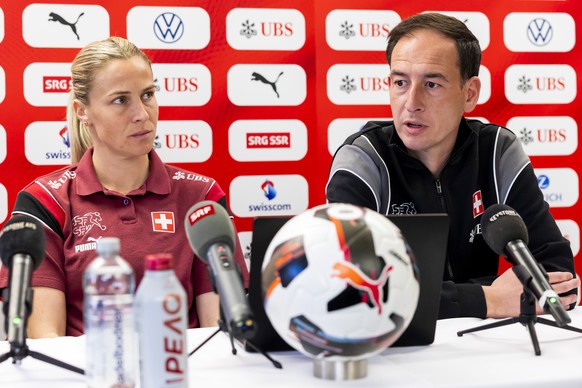 Switzerland's head coach Rafel Navarro, right, sitting next to Switzerland's Ana-Maria Crnogorcevic, left, speaks to the media, during a press conference of the Switzerland women's nati ...