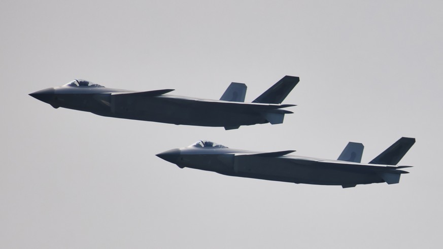 epa09494955 A pair of Chengdu J-20 aircrafts perform during the 13th China International Aviation and Aerospace Exhibition in Zhuhai, Guangdong province, China, 29 September 2021. The event, also know ...