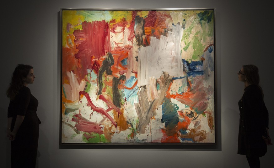 epa05563503 Gallery assistants look at &#039;Untitled XXV&#039; by Willem de Kooning, art artwork that forms part of the New York evening sale during a press preview at Christie&#039;s Auction House i ...