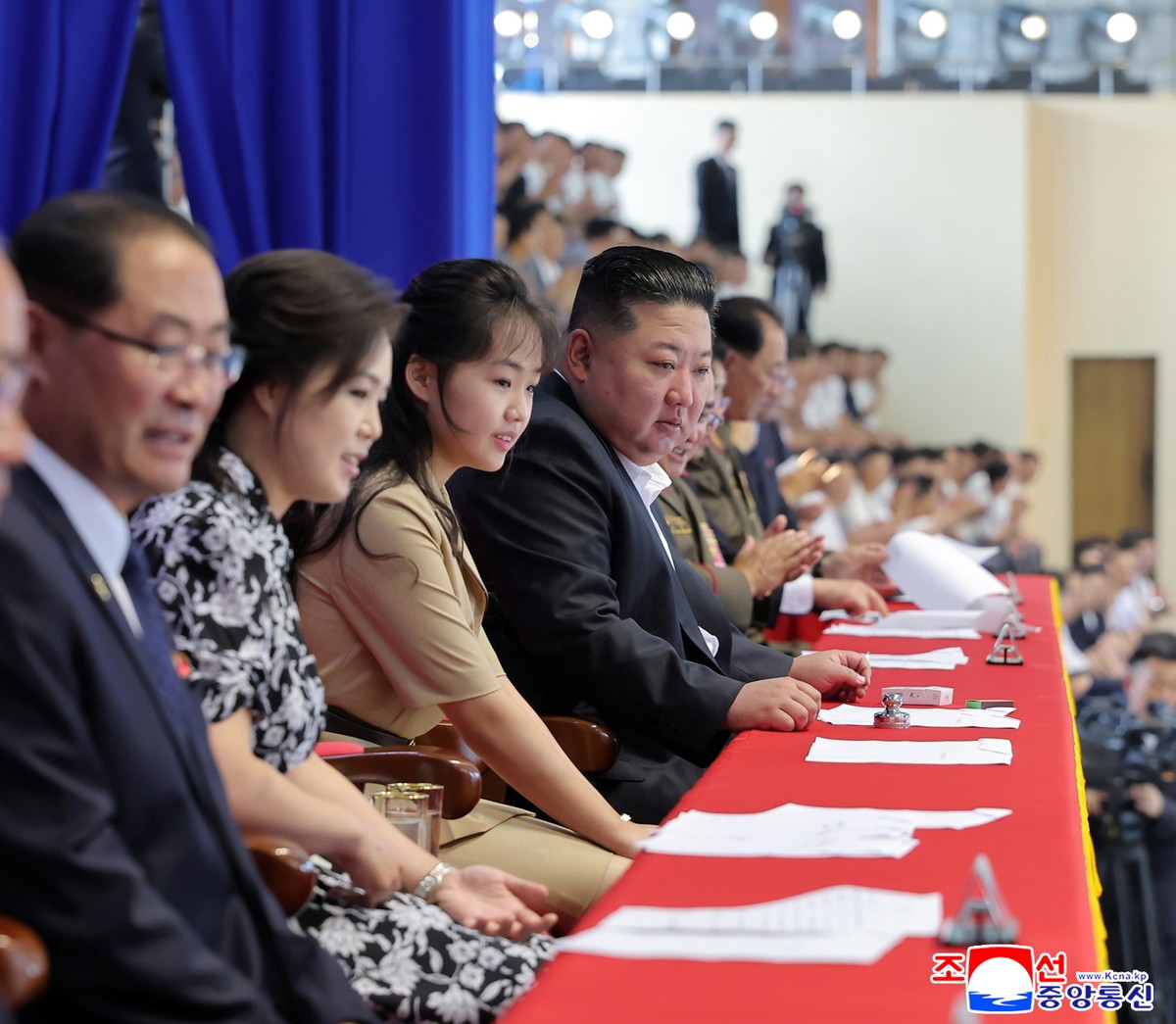 epa13175134 North Korean leader Kim Jong Un (C), daughter Kim Ju Ae (3-L), and wife Ri Sol-ju (2-L) attend a swimming and diving contest marking the 81st anniversary of National Liberation in Pyongyan ...
