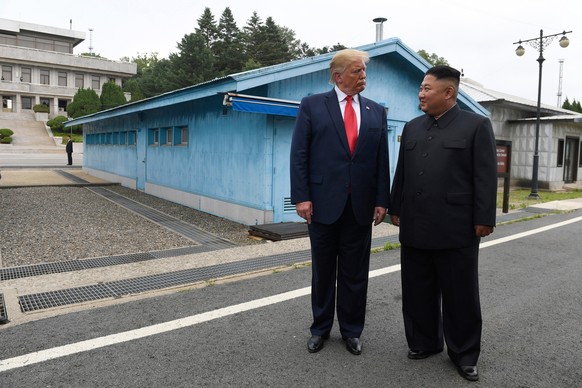 FILE - In this June 30, 2019, file photo, U.S. President Donald Trump, left, meets with North Korean leader Kim Jong Un at the border village of Panmunjom in Demilitarized Zone, South Korea. North Kor ...