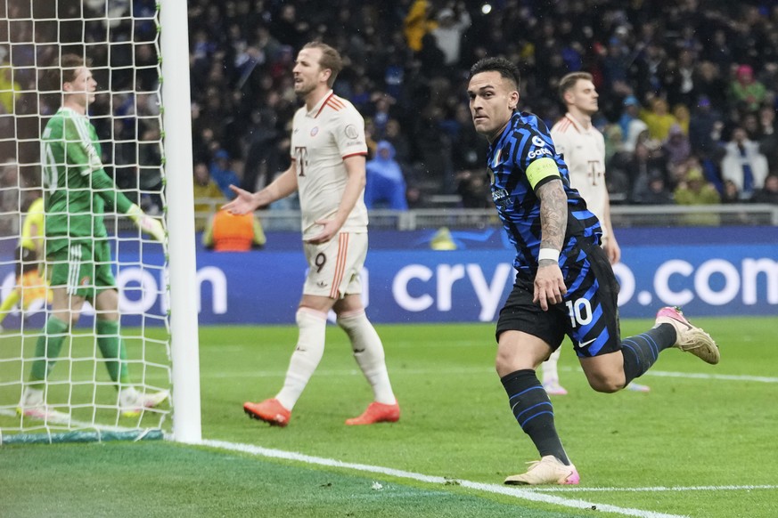 Inter Milan&#039;s Lautaro Martinez, right, celebrates after scoring his side&#039;s opening goal during the Champions League quarterfinal second leg soccer match between Inter Milan and Bayern Munich ...