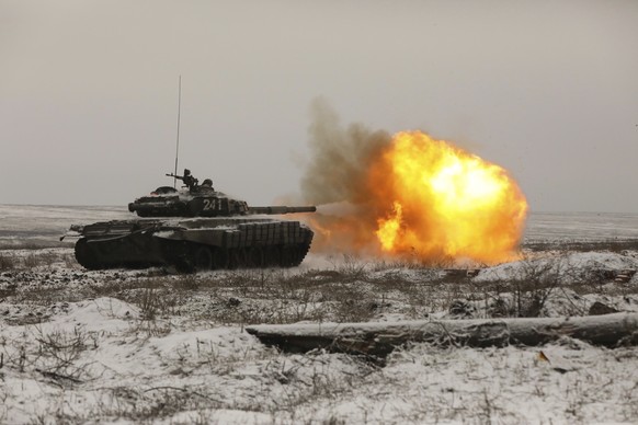 A Russian tank T-72B3 fires as troops take part in drills at the Kadamovskiy firing range in the Rostov region in southern Russia, Wednesday, Jan. 12, 2022. Russia has rejected Western complaints abou ...