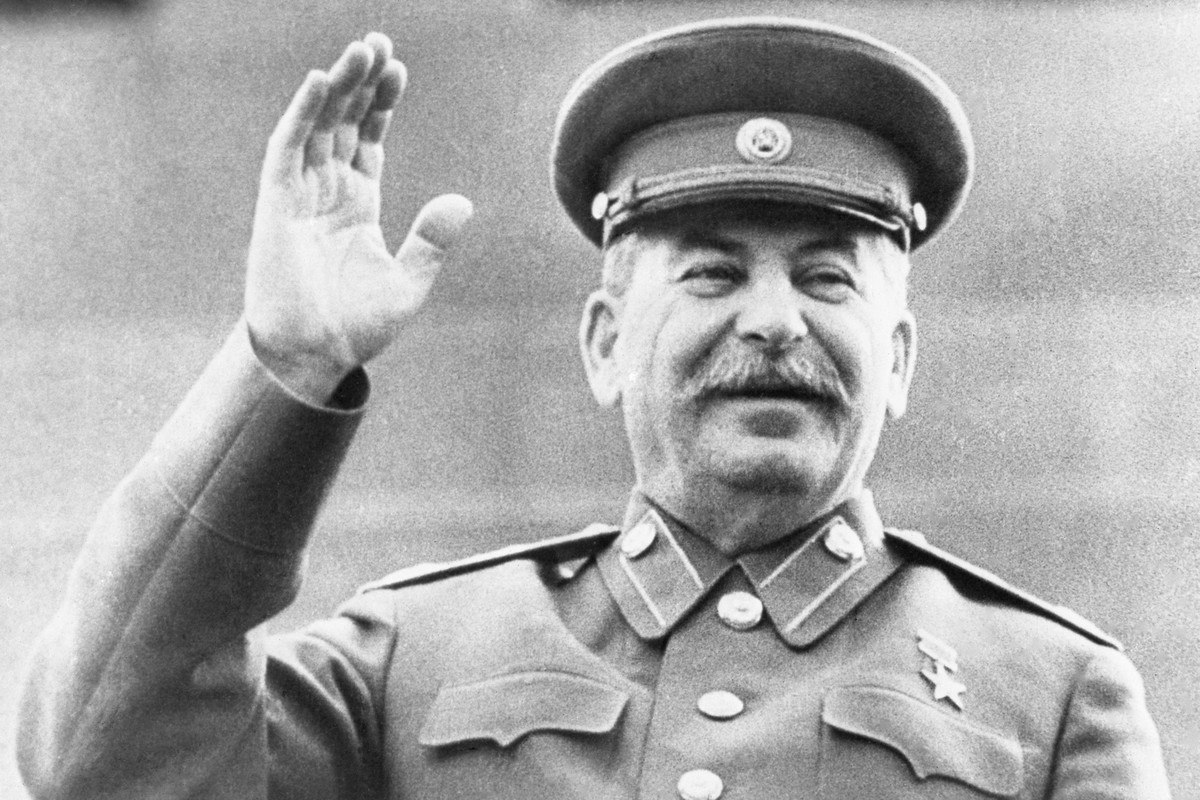 FILE - Soviet leader Josef Stalin raises his right hand in salute while reviewing a May Day Parade in Red Square in Moscow, on May 1, 1946. Abortions were banned under Stalin but became commonplace un ...