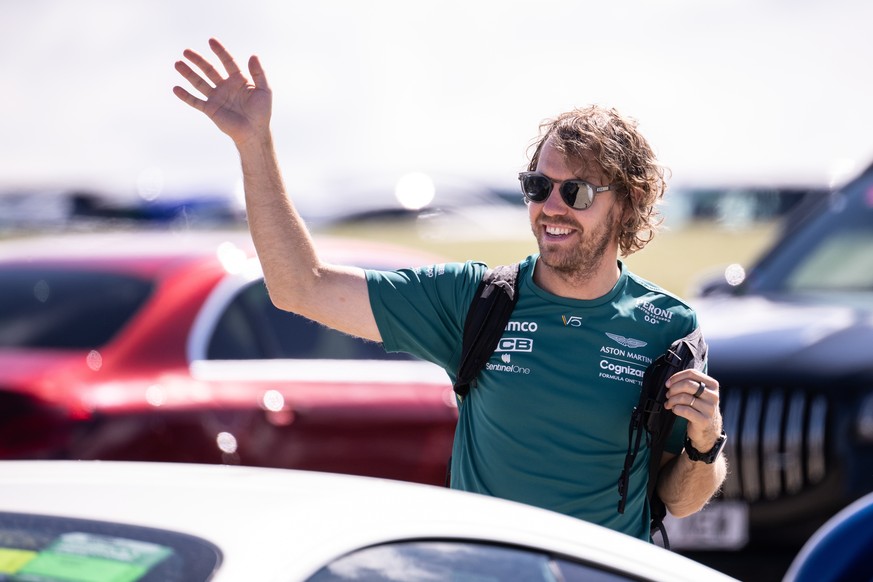 epa10049141 German Formula One driver Sebastian Vettel of Aston Martin arrives for the Formula One Grand Prix of Britain at the Silverstone Circuit, Silverstone, Britain, 03 July 2022. EPA/CHRISTIAN B ...