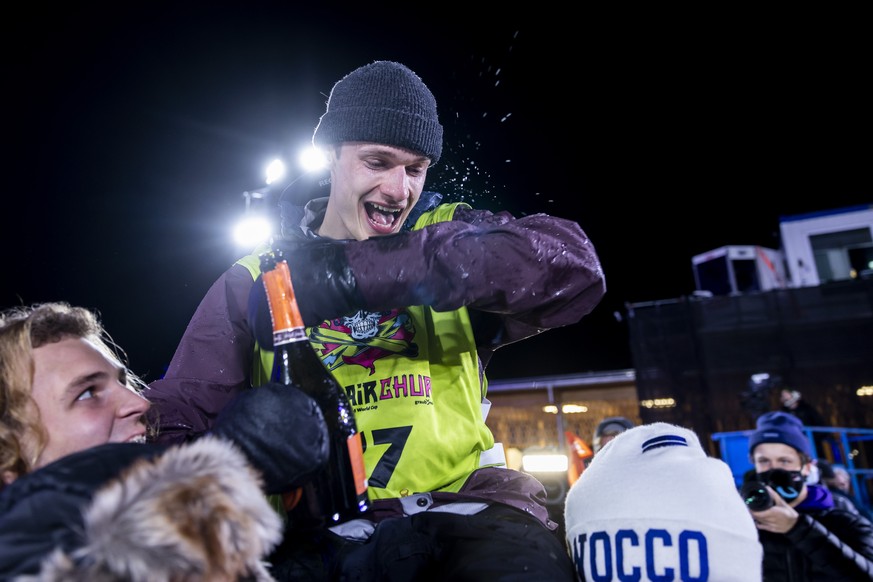 Jonas Boesiger, Switzerland, gets a champagne shower after Men&#039;s Snowboard Big Air final at the FIS Snowboard Big Air Worldcup in Chur, Switzerland, on Saturday, October 23, 2021. (KEYSTONE/Chris ...
