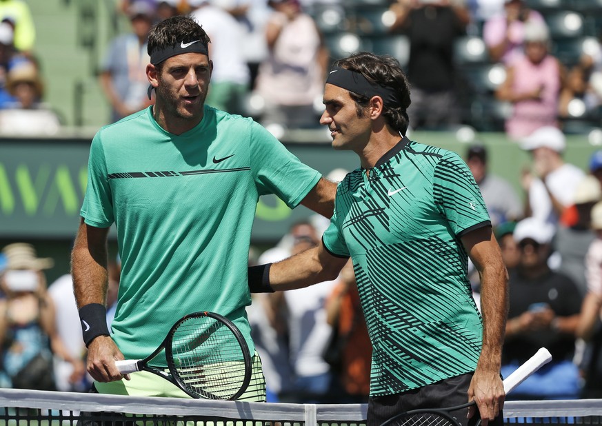 Roger Federer, of Switzerland, right, and Juan Martin del Potro, of Argentina, take a photo together before the start of a tennis match at the Miami Open, Monday, March 27, 2017 in Key Biscayne, Fla.  ...