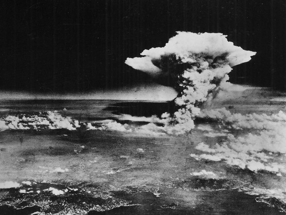 In this handout picture released by the U.S. Army, a mushroom cloud billows about one hour after a nuclear bomb was detonated above Hiroshima, Japan on Aug. 6, 1945. Japanese officials say a 93-year-o ...