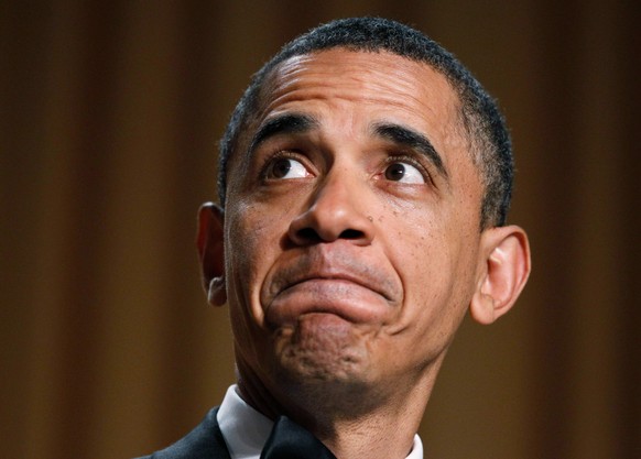 FILE - President Barack Obama makes a face as they show his video during his speech at the White House Correspondents' Association Dinner in Washington, April 30, 2011. (AP Photo/Manuel Balce Cen ...