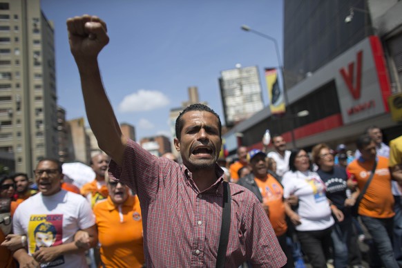 A man shouts slogans against government of President Nicolas Maduro as protesters gather for a demonstration in Caracas, Venezuela, Saturday, April 8, 2017. Opponents of President Nicolas Maduro are p ...