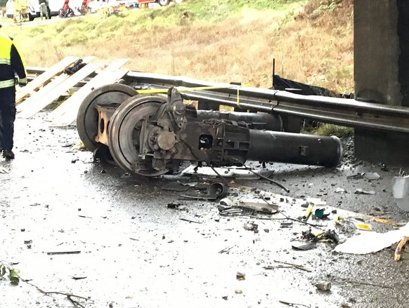 epa06397758 A handout photo made available by the Pierce County Sheriffs Department showing the trucks of Amtrak train 501 which derailed onto Interstate 5 near Tacoma, Washington, USA, 18 December 20 ...