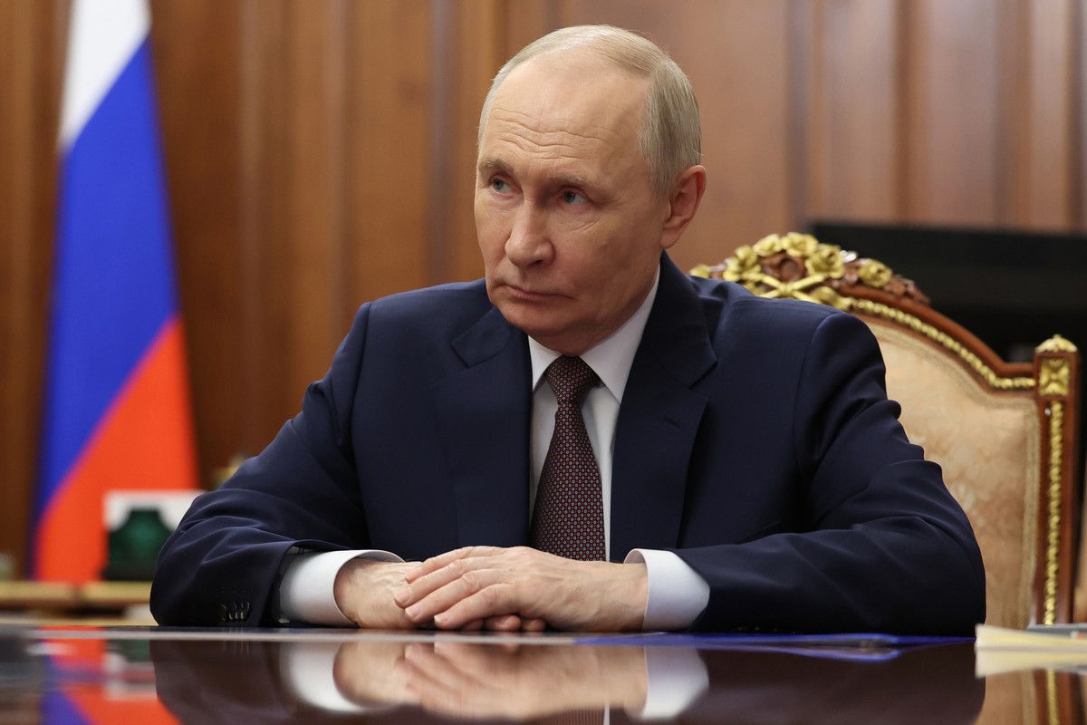 Russian President Vladimir Putin listens to Omsk Region Governor Vitaly Khotsenko during their meeting at the Kremlin in Moscow, Monday, May 25, 2026. (Vyacheslav Prokofyev/Sputnik, Kremlin Pool Photo ...