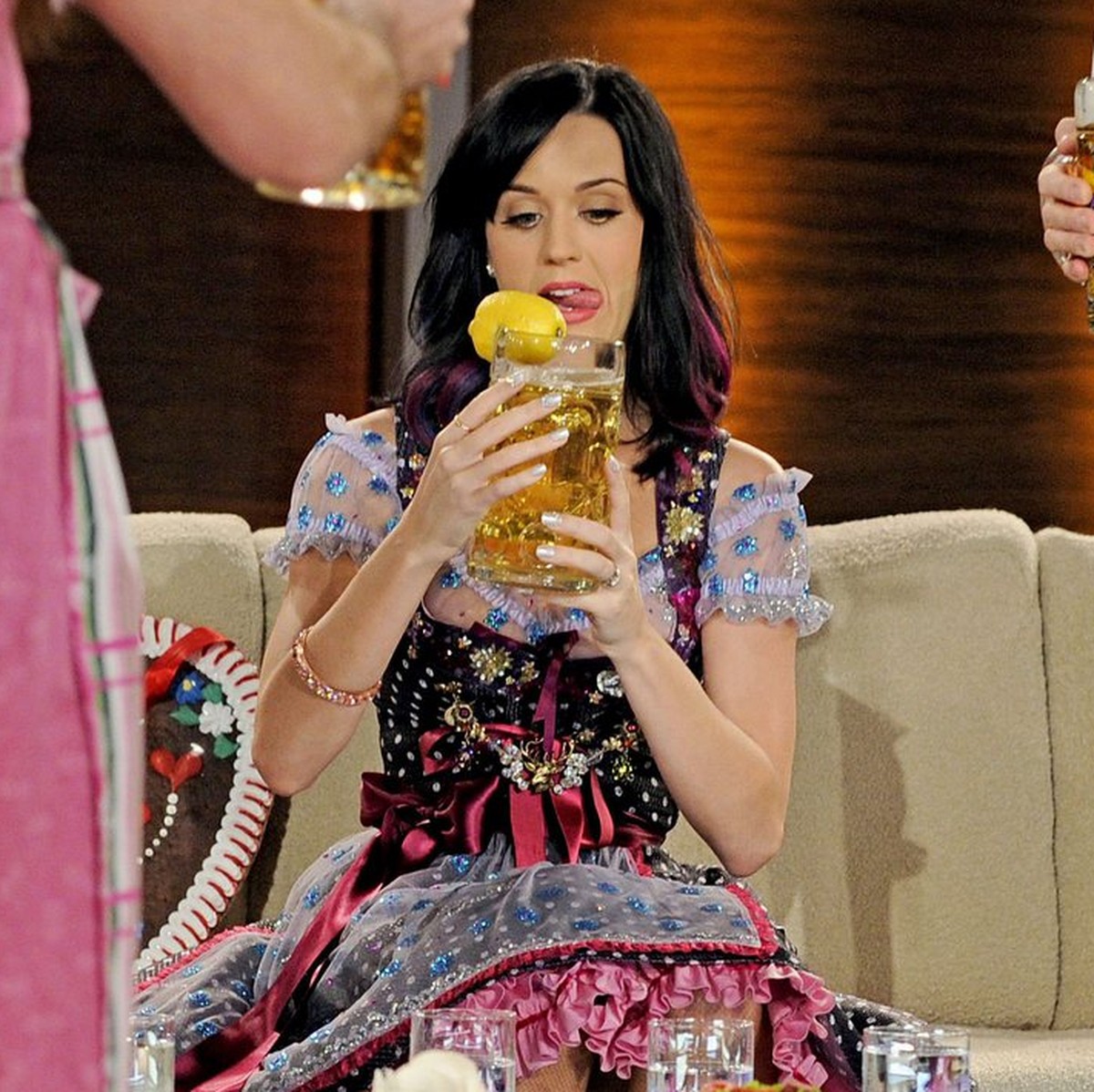 epa02370640 A picture made available on 03 October shows US singer Katy Perry holding a beer during the German TV show Wetten, dass...? (Lit:'You bet') in Munich, Germany, 02 October 2010. T ...