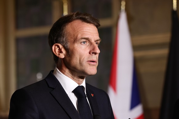 French President Emmanuel Macron addresses a press conference after the Coalition of the Willing summit on security guarantees for Ukraine in Paris, Monday, July 13, 2026. (Teresa Suarez/Pool Photo vi ...