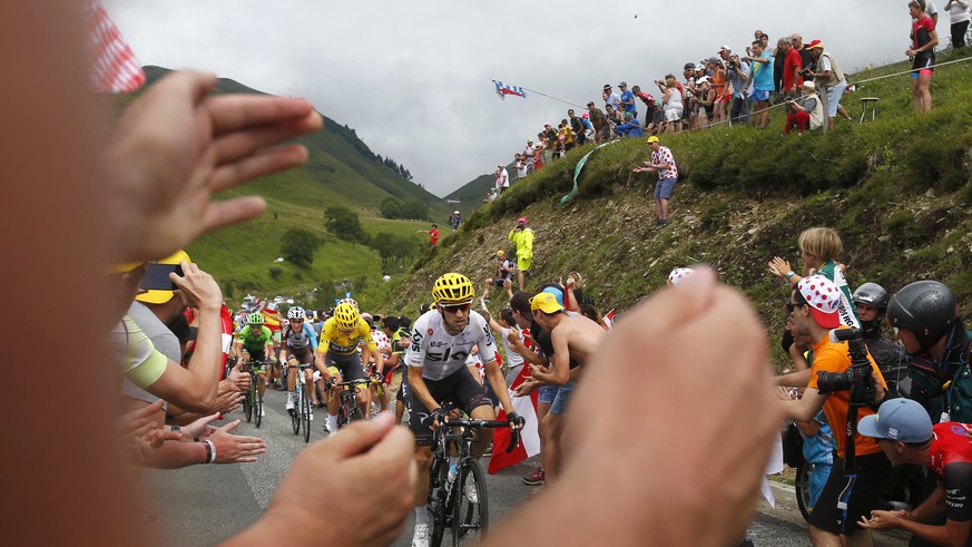 Spain's Mikel Nieve, Britain's Chris Froome, wearing the overall leader's yellow jersey, stage winner France's Romain Bardet, and Colombia's Rigoberto Uran, from front to rear, climb Peyresourde pass  ...