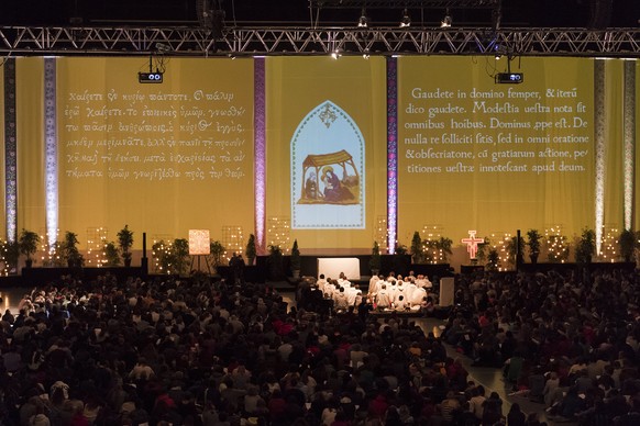 epa06408310 An evening prayer on the occasion of the fortieth annual international young adults meeting of the ecumenical Christian monastic order of the Taize Community, in Basel, Switzerland, 28 Dec ...