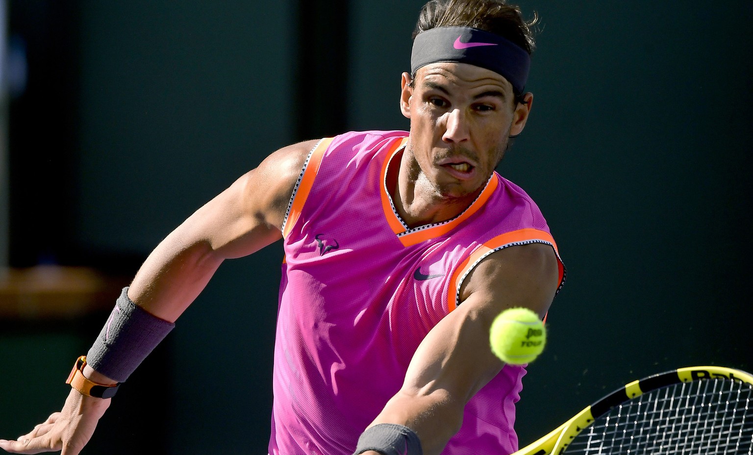 FILE - In this March 15, 2019, file photo, Rafael Nadal, of Spain, hits a volley to Karen Khachanov, of Russia, at the BNP Paribas Open tennis tournament in Indian Wells, Calif. As Novak Djokovic begi ...