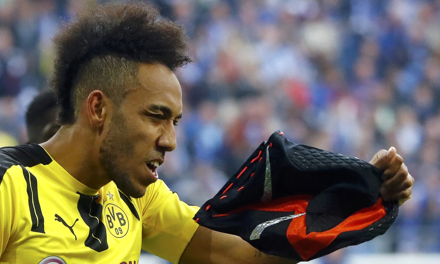 Football Soccer - Schalke 04 v Borussia Dortmund - German Bundesliga - Veltins Arena, Gelsenkirchen, Germany - 1/04/17 - Borussia Dortmund&#039;s Pierre-Emerick Aubameyang removes a mask as he celebra ...