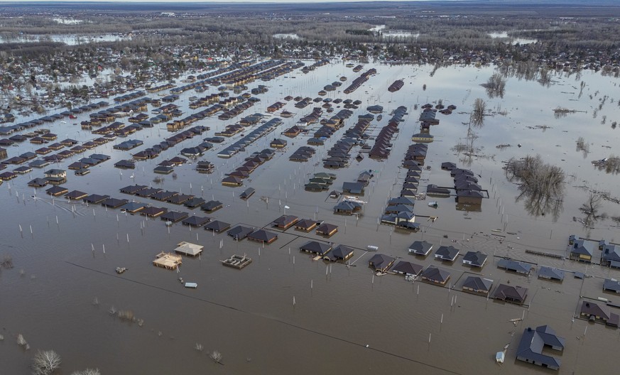 epa11273198 An aerial photo taken with a drone shows the flooded residential area of the outskirts of Orenburg, Orenburg region, Russia, 11 April 2024. The flood situation in the Orenburg region has r ...