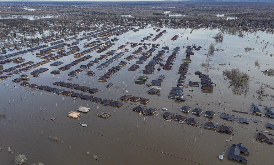 epa11273198 April 11, 2024 An aerial photo taken by a drone shows a flooded residential area on the outskirts of Orenburg, Orenburg Region, Russia, on April 11, 2024.