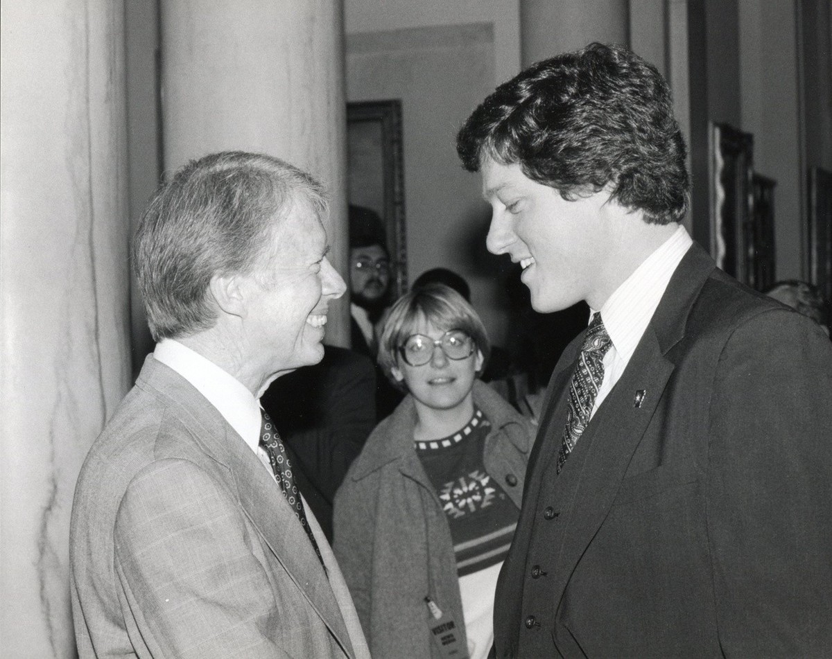 epa11798059 (FILE) A handout photo made available by the Jimmy Carter Library shows US President Jimmy Carter (L) meeting with Arkansas Governor-elect Bill Clinton at The White House in Washington, DC ...