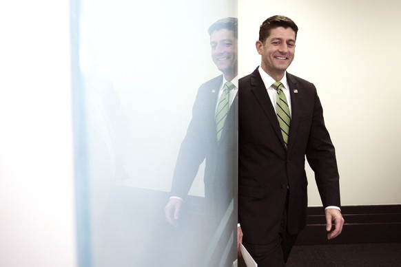 House Speaker Paul Ryan of Wis. is reflected in a glass door as he arrives to speak with reporters following the Republican Caucus meeting on Capitol Hill in Washington, Tuesday, May 2, 2017. (AP Phot ...