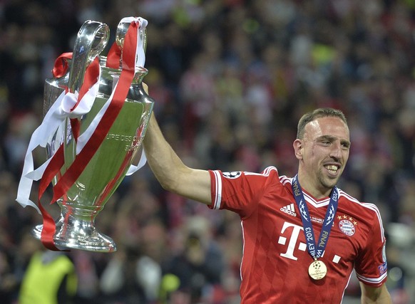 FILE - In this May 25, 2013 file photo, Bayern Munich&#039;s Franck Ribery of France lifts the trophy after winning the Champions League Final at Wembley Stadium in London. France great Franck Ribery  ...