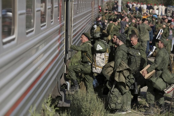 Russian recruits take a train at a railway station in Prudboi, Volgograd region of Russia, Thursday, Sept. 29, 2022. Russian President Vladimir Putin has ordered a partial mobilization of reservists t ...