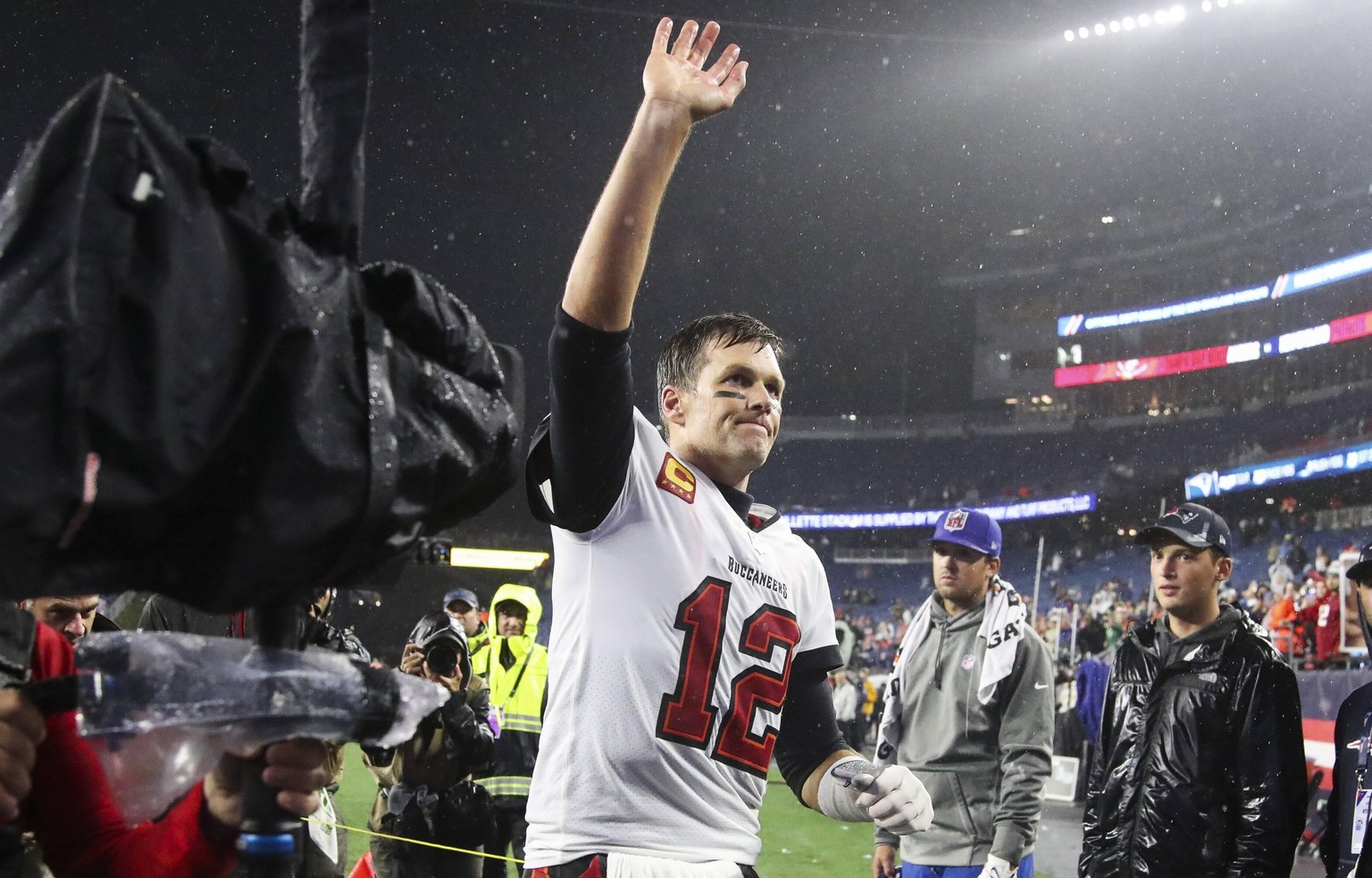 October 3, 2021, Foxborough, Florida, USA: Tampa Bay Buccaneers quarterback Tom Brady (12) waves to the fans as he run off the field after the Bucs beat New England Patriots at Gillette Stadium on Sun ...