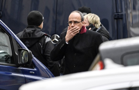 Hessen provinces interior minister Peter Beuth walks in front of the hookah bar where several people were killed on Wednesday in Hanau, Germany, Thursday, Feb. 20, 2020. A 43-year-old German man shot  ...