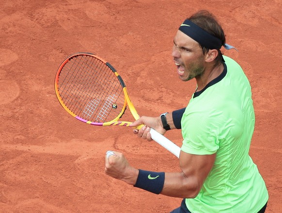 epa09249675 Rafael Nadal of Spain in action against Cameron Norrie of Britain during their third round match at the French Open tennis tournament at Roland Garros in Paris, France, 05 June 2021. EPA/C ...