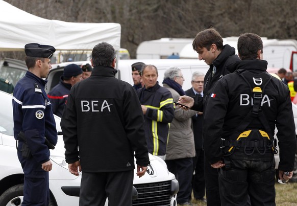 epa04678811 Members of BEA, the French Air Accident Investigation Agency arrive in Seyne-les-Alpes, France, 25 March 2015, after a Germanwings jetliner crashed in the French Alps. French investigators ...