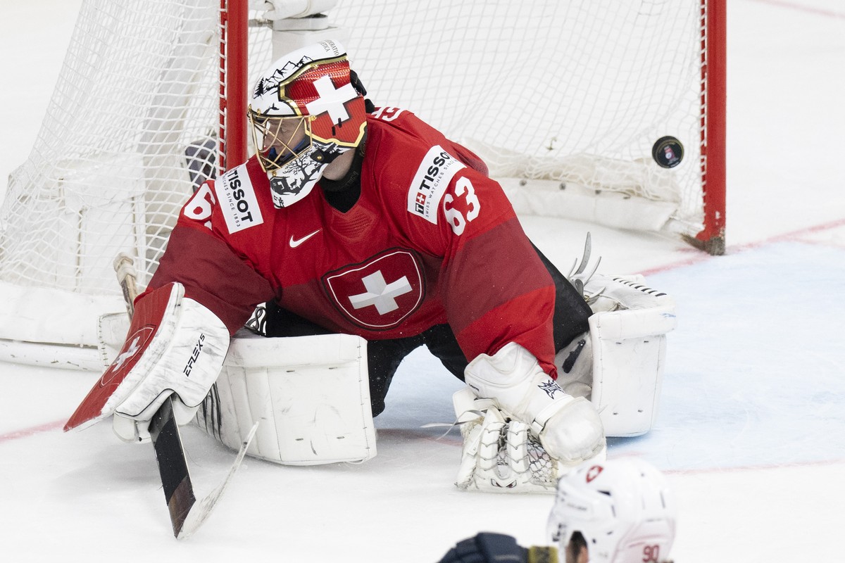 Switzerland's Goalkeeper Leonardo Genoni reacts after the first scoring to 1-0 during the Ice Hockey World Championship final match between Switzerland and Czech Republic in Prague at the O2 Aren ...