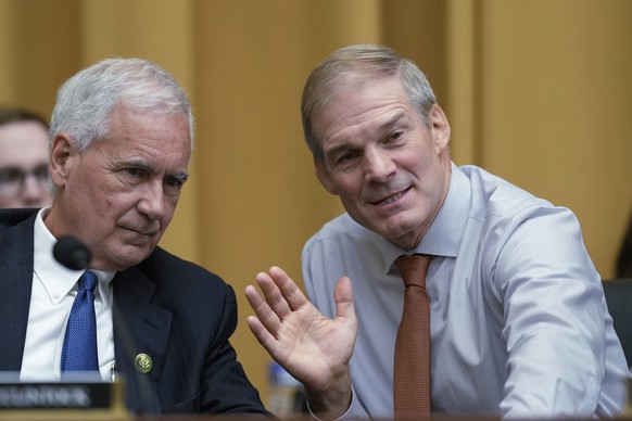 Rep. Tom McClintock, R-Calif., left, confers with House Judiciary Committee Chairman Jim Jordan, R-Ohio, as Attorney General Merrick Garland faces his most ardent critics as House Republicans during a ...