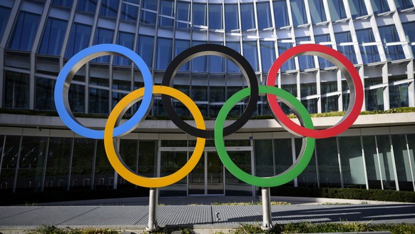 FILE -Olympic Rings are pictured in front of The Olympic House, headquarters of the International Olympic Committee (IOC) at the opening of the executive board meeting of the International Olympic Com ...
