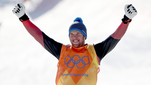 epa06548862 Silver medal winner Marc Bischofberger of Switzerland celebrates on the podium during the venue ceremony after the men&#039;s Freestyle Skiing Ski Cross Finals at the Bokwang Phoenix Park  ...