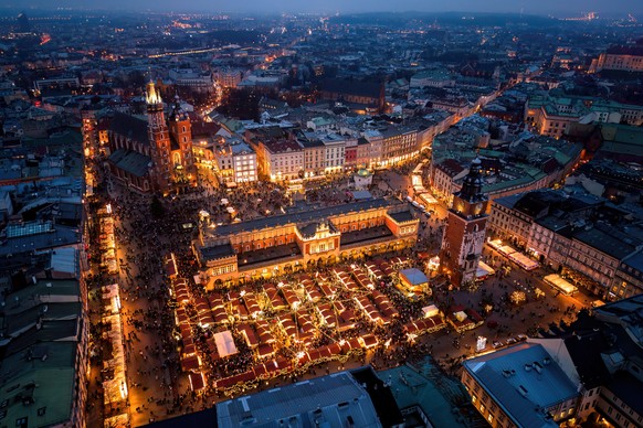 epa12575190 A picture taken with a drone shows a Christmas market at the Main Market Square in Krakow, Poland, 06 December 2025. EPA/Lukasz Gagulski POLAND OUT