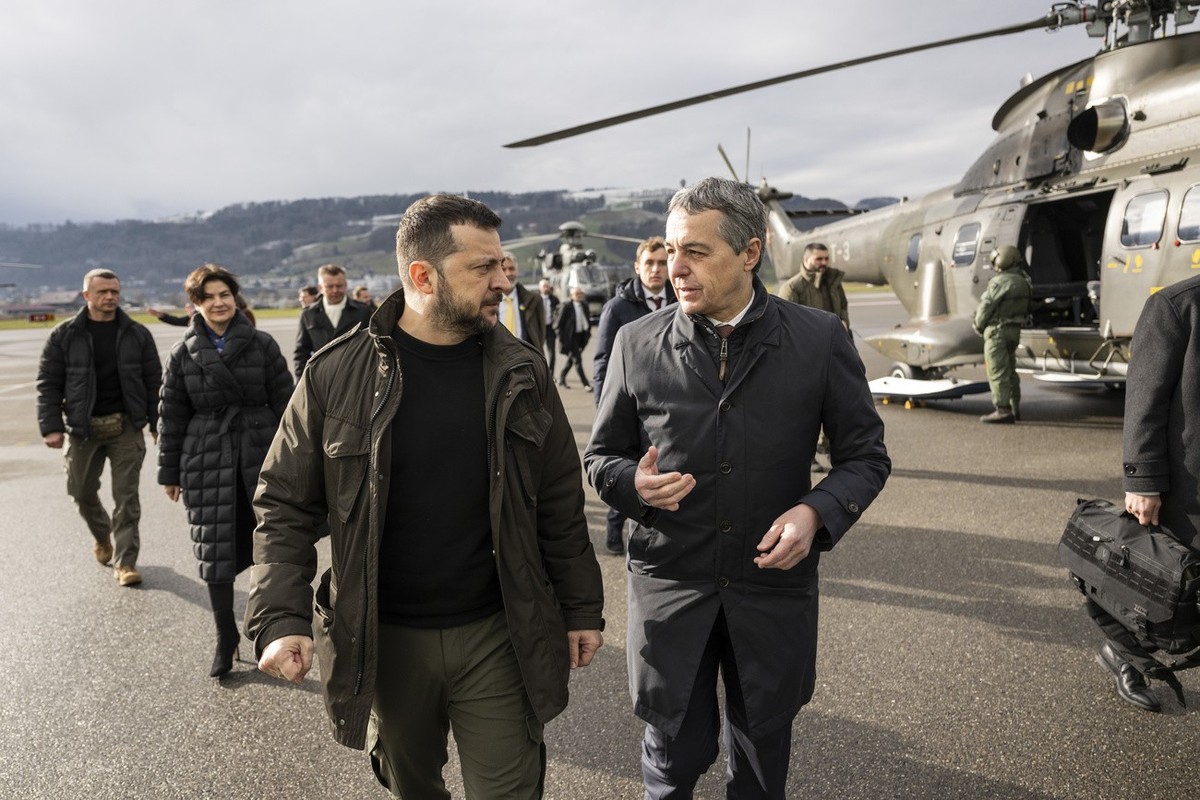 Volodymyr Zelenskyy, President of Ukraine, left, is welcomed by Switzerland's Foreign Minister Federal Councillor Ignazio Cassis, on Monday, January 15, 2024 at the Airport Bern Belp, Switzerland ...