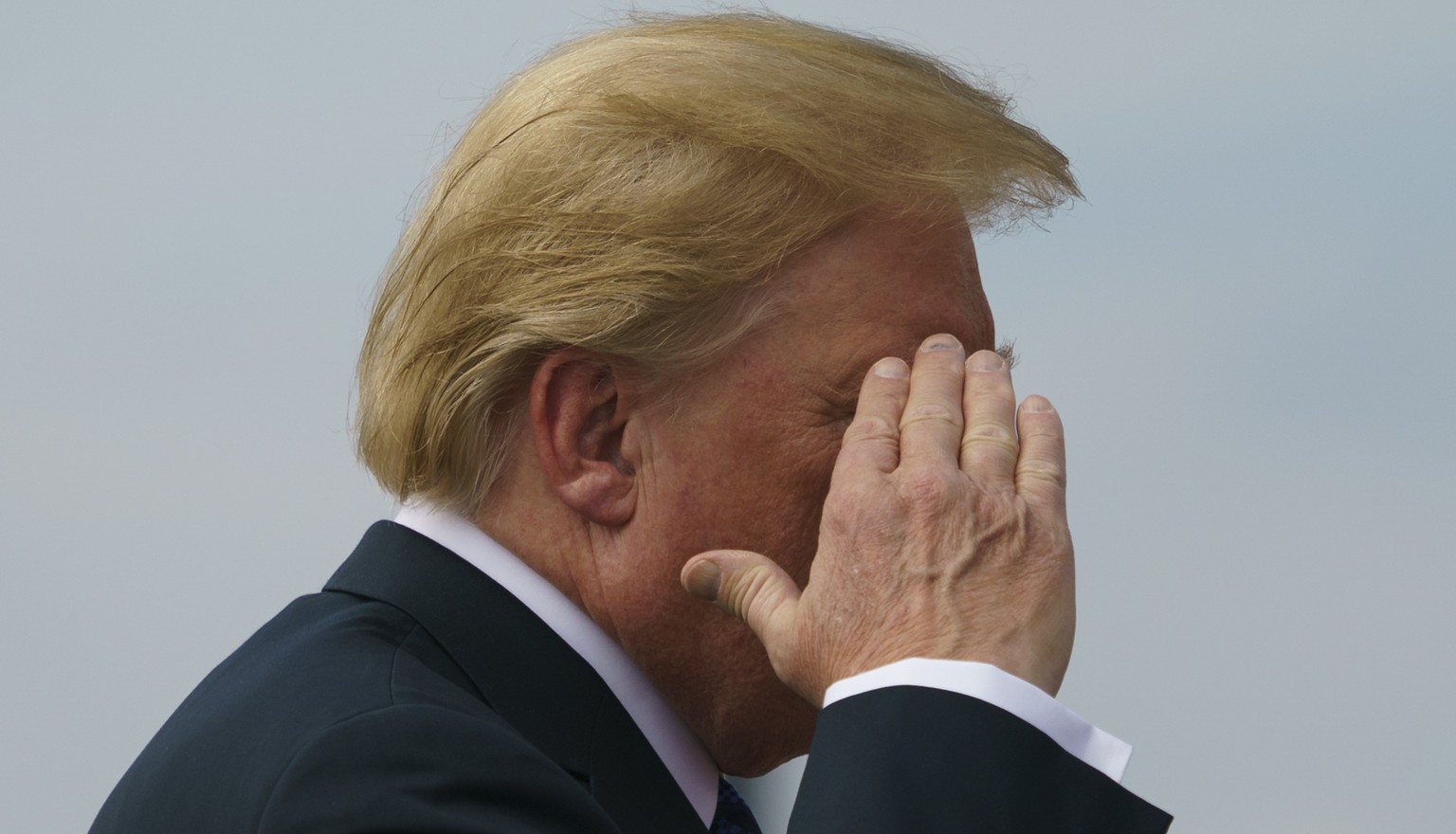 President Donald Trump salutes as he boards Air Force One, Friday, July 20, 2018, in Andrews Air Force Base, Md., en route to Morristown Municipal Airport, in Morristown, N.J., and on to Trump Nationa ...