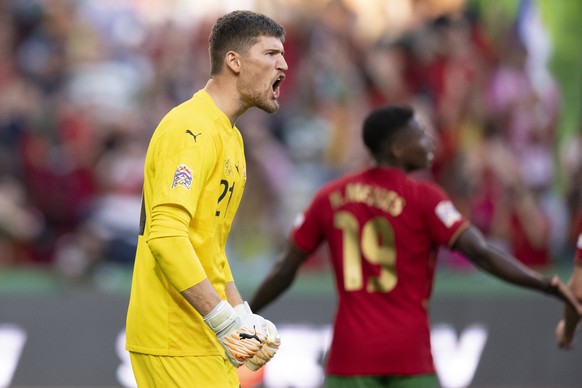 Switzerland&#039;s goalkeeper Gregor Kobel, left, reacts, during the UEFA Nations League group A2 soccer match between Portugal and Switzerland at the Estadio Jose Alvalade stadium, in Lisbon, Portuga ...