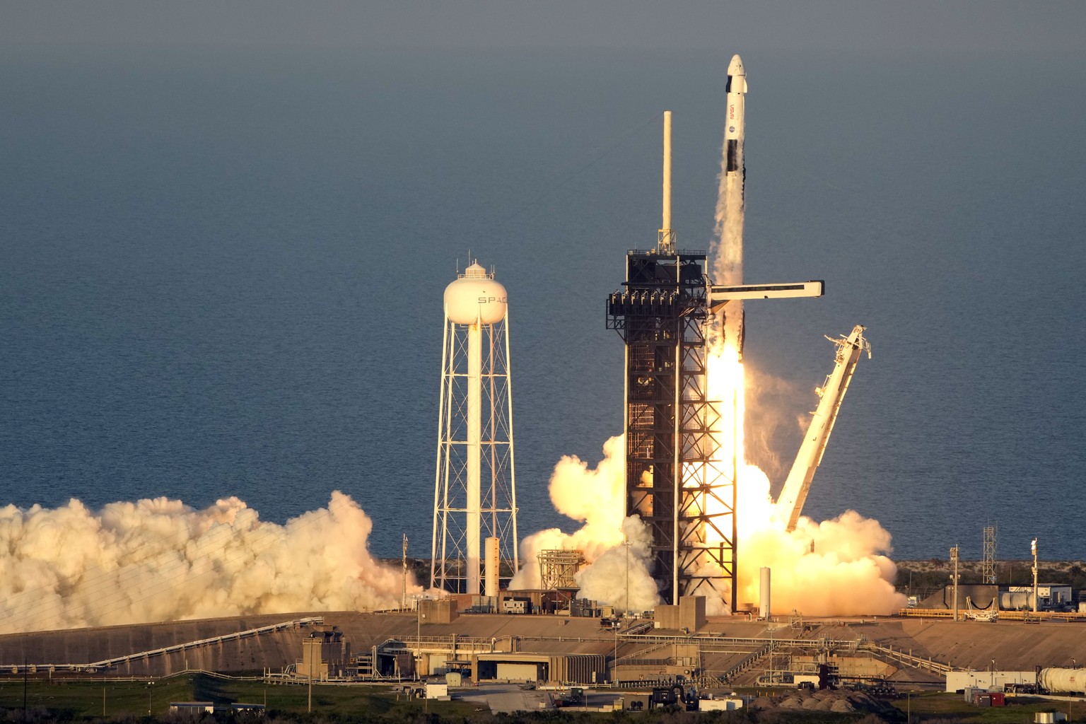 A SpaceX Falcon 9 rocket, with a crew of four aboard the Crew Dragon spacecraft, lifts off on a mission to the International Space Station lifts off from pad 39A at the Kennedy Space Center in Cape Ca ...