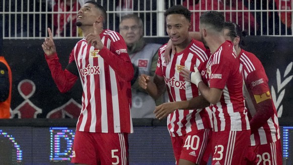 Union's Danilho Doekhi, left, celebrates after scoring his side's 2nd goal during the German Bundesliga soccer match between 1. FC Union Berlin and TSG 1899 Hoffenheim in Berlin, Germany, Saturday, Ja ...