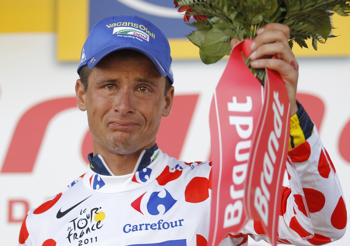 Johnny Hoogerland of The Netherlands, wearing the best climber's dotted jersey, cries on the podium of the 9th stage of the Tour de France cycling race over 208 kilometers (129 miles) starting in ...