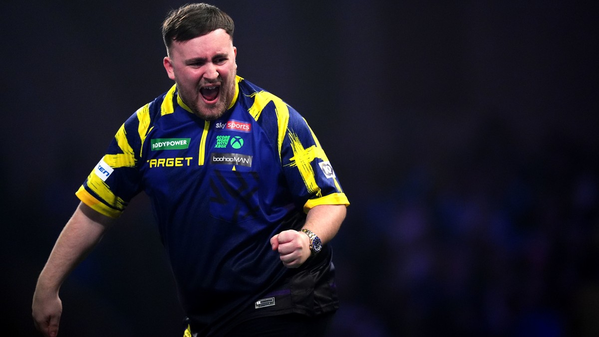 England's Luke Littler reacts during his match against England's Rob Cross on day sixteen of the World Darts Championship at the Alexandra Palace, in London, Monday, Dec. 29, 2025. (John Wal ...