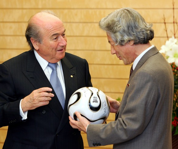 FIFA President Sepp Blatter, left, presents the official match ball for the 2006 FIFA World Cup to Japan&#039;s Prime Minister Junichiro Koizumi at the premier&#039;s official residence in Tokyo on Th ...