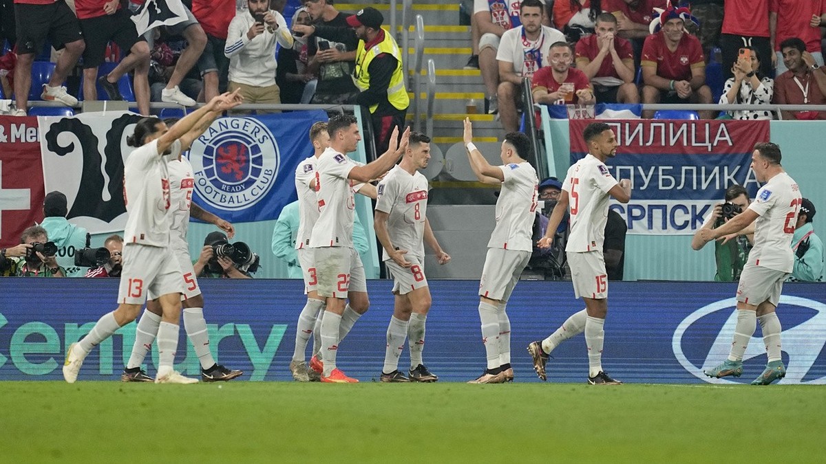 Switzerland's Remo Freuler, center, celebrates with teammates after scoring his side's third goal during the World Cup group G soccer match between Serbia and Switzerland, at the Stadium 974 ...