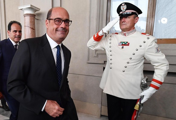 epaselect epa07785374 Democratic Party (PD) leader Nicola Zingaretti (C), followed by party colleague Andrea Marcucci (L), leaves after a meeting with Italian President Mattarella for a second round o ...